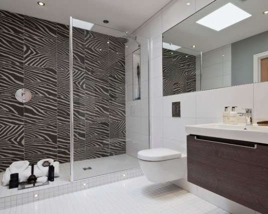 modern-zebra-print-bathroom-ideas-with-glass-shower-area-and-dark-vanity-with-undermount-sink-also-modern-mirror-and-bright-neon-lighting