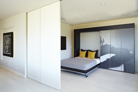 Modern-minimalist-bedroom-with-retractable-walls-design-feat-murphy-bed-on-wood-panel-flooring-and-wall-paneling-system-with-recessed-lighting-ideas-nice-closet-decal-ideas