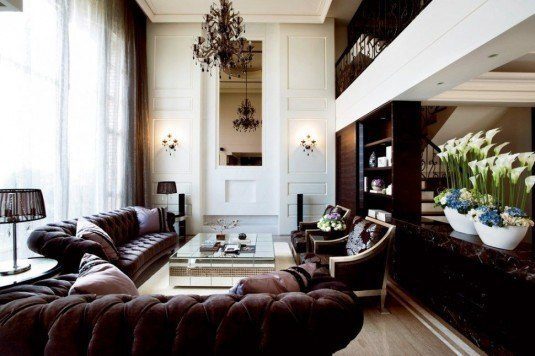 cool-living-room-design-ideas-with-luxurious-dark-brown-leather-tufted-sofa-beside-floor-to-ceiling-bay-window-covered-with-white-sheer-vertical-curtain-970x646