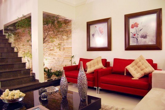 Modern-White-Living-Room-with-Red-Sofa-and-Courtyard-red-living-room-furniture