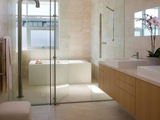 apartment-bathroom-design-with-rectangular-bathtub-plus-glass-door-also-light-oakwood-bathroom-vanity-units