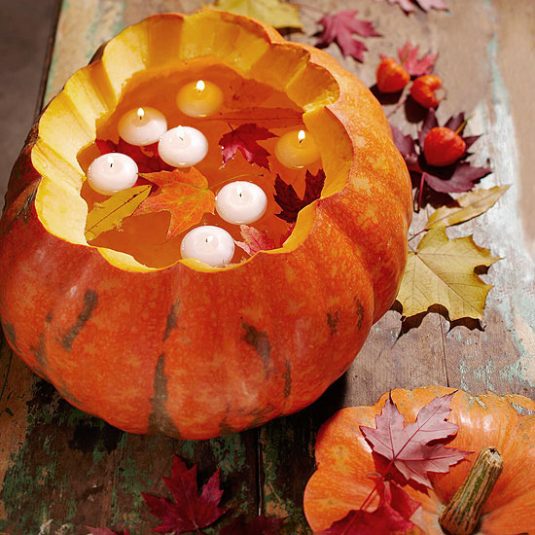 carved-pumpkins-with-floating-candles