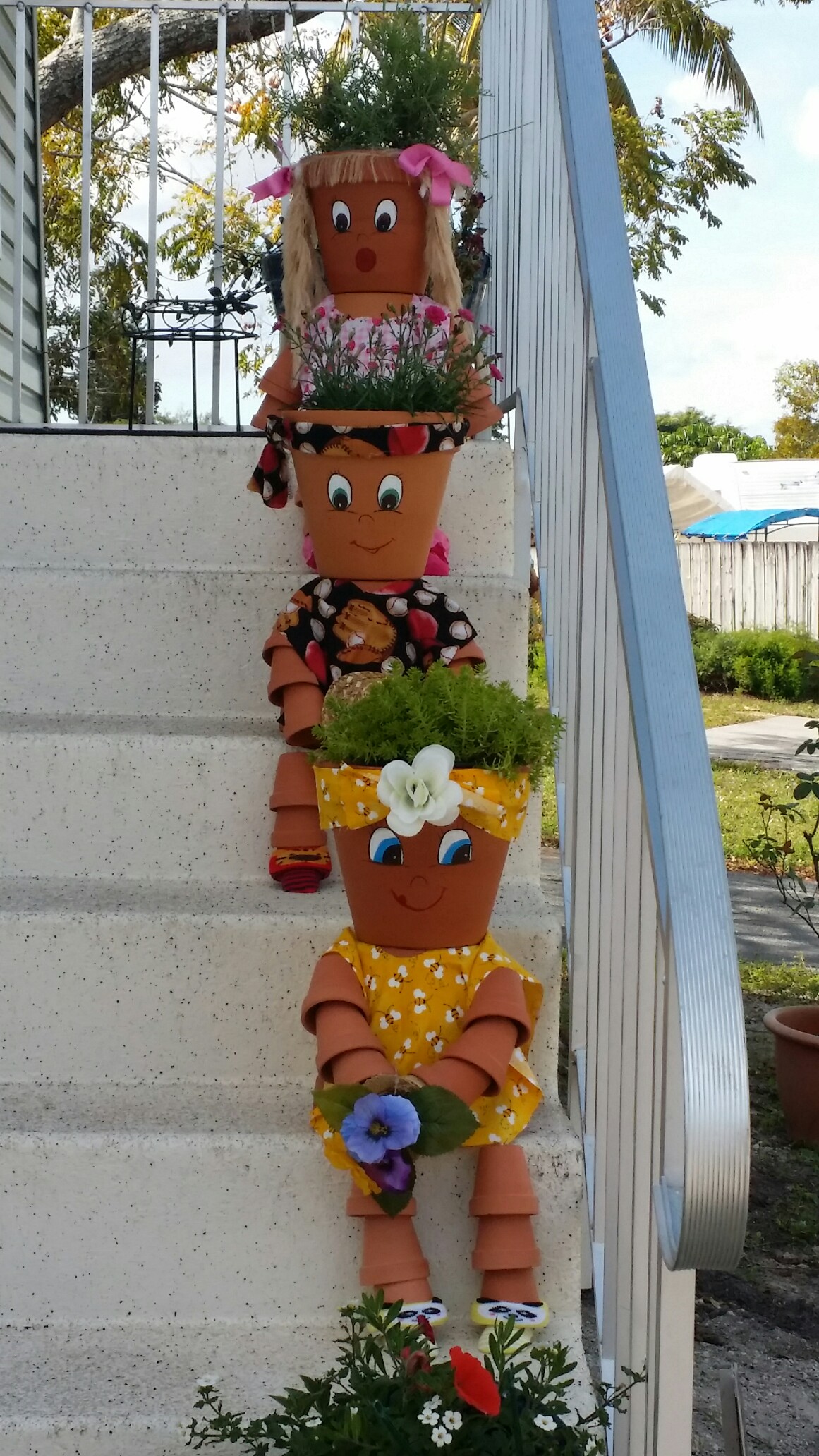 Cheap DIY Clay Pot People To Cheer Up Your Garden